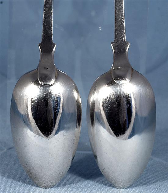 A pair of William IV silver fiddle pattern serving spoons and a similar Victorian pair, Length 237mm, weight 4.9oz/153grms
